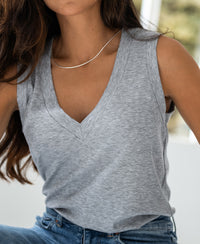 Woman wearing a light grey lyocell top.