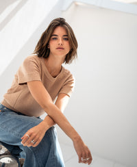 Soft camel linen summer sweater in natural light.