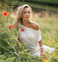 Ivory ribbed boatneck T-shirt by PLEIN PUBLIQUE, shown worn by a woman seated outdoors.