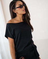 Charcoal rib boat neck T-shirt in the LA SOMME style by PLEIN PUBLIQUE, shown indoors against a light background.