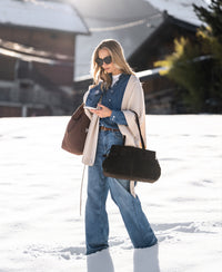 Light stone wide-leg jeans by Plein Publique, shown worn outdoors on snow.