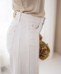 Wide leg white jeans, side view.