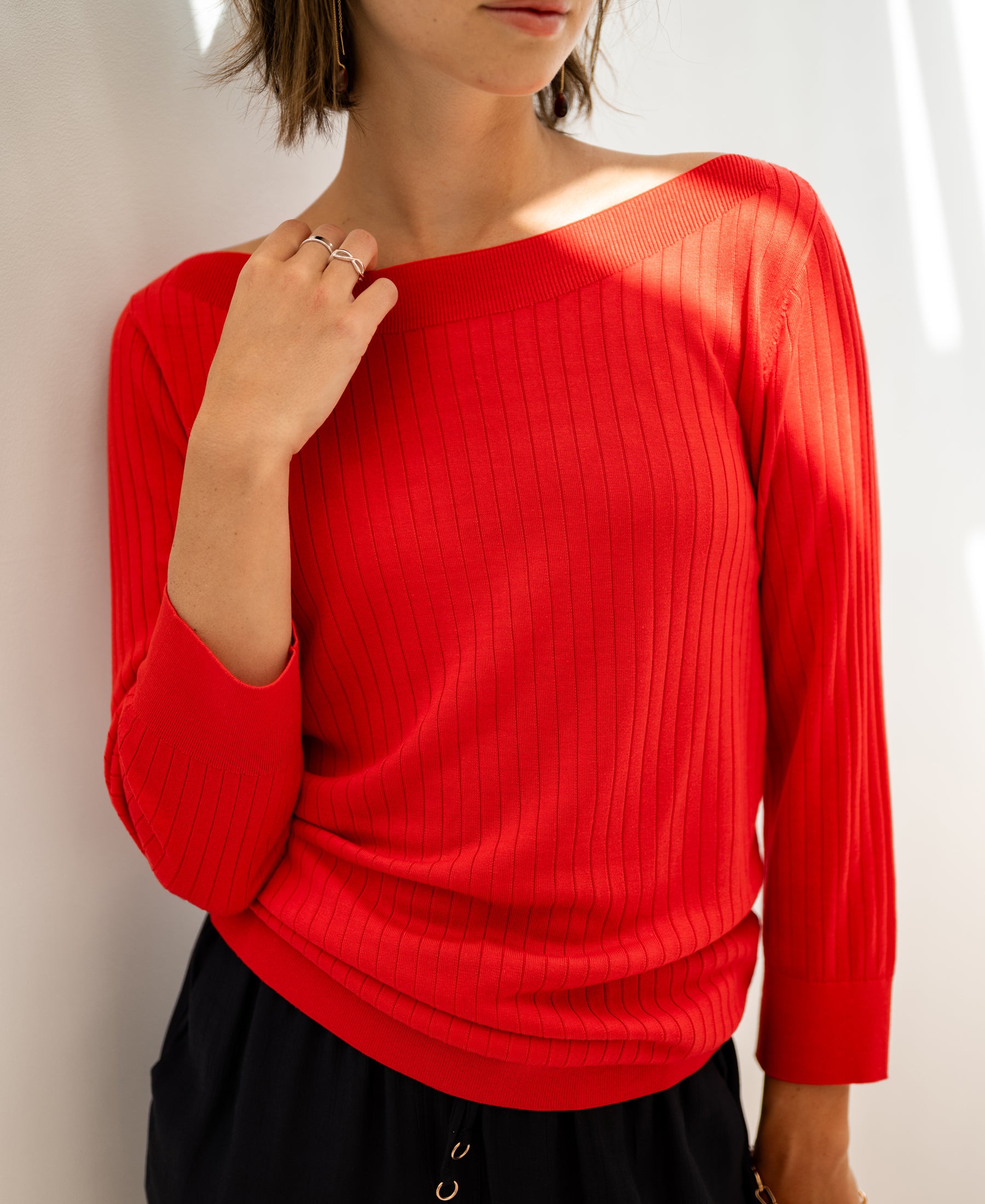 Coral red Tencel-silk boat neck sweater by Plein Publique, model LA TULIPE, shown against a white background.