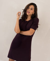 Aubergine wool dress by PLEIN PUBLIQUE, called LA TWIGGY, shown against a light background, side view.