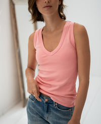 Luxe and soft light flamingo pink LA VALE top by PLEIN PUBLIQUE, shown indoors against a neutral background.