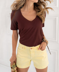Yellow soft PLEIN PUBLIQUE LA BILLY shorts shown on model against a white background.