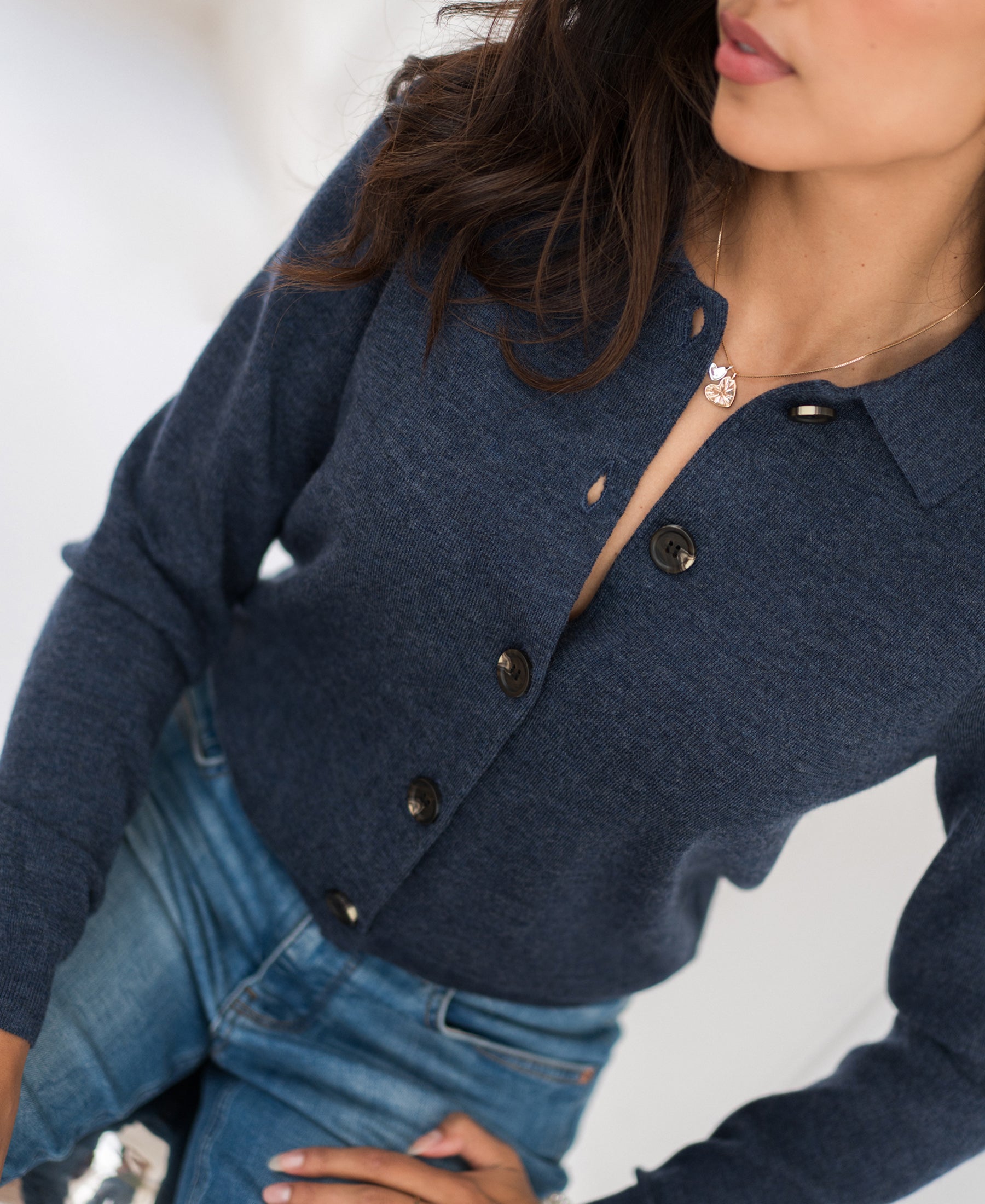 Woman wearing the LES VINGT indigo blue vest with polo collar by PLEIN PUBLIQUE.