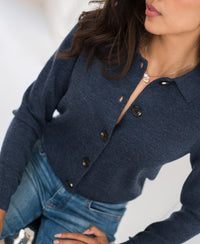 Woman wearing the LES VINGT indigo blue vest with polo collar by PLEIN PUBLIQUE.