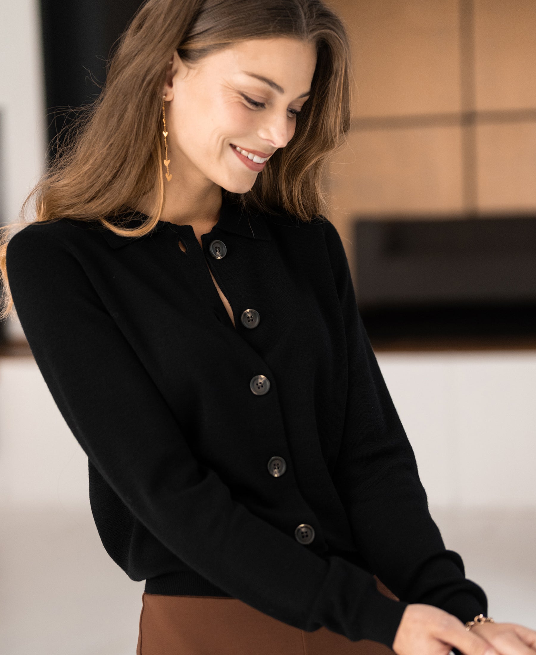 Black polo-collar cardigan by PLEIN PUBLIQUE, front view.