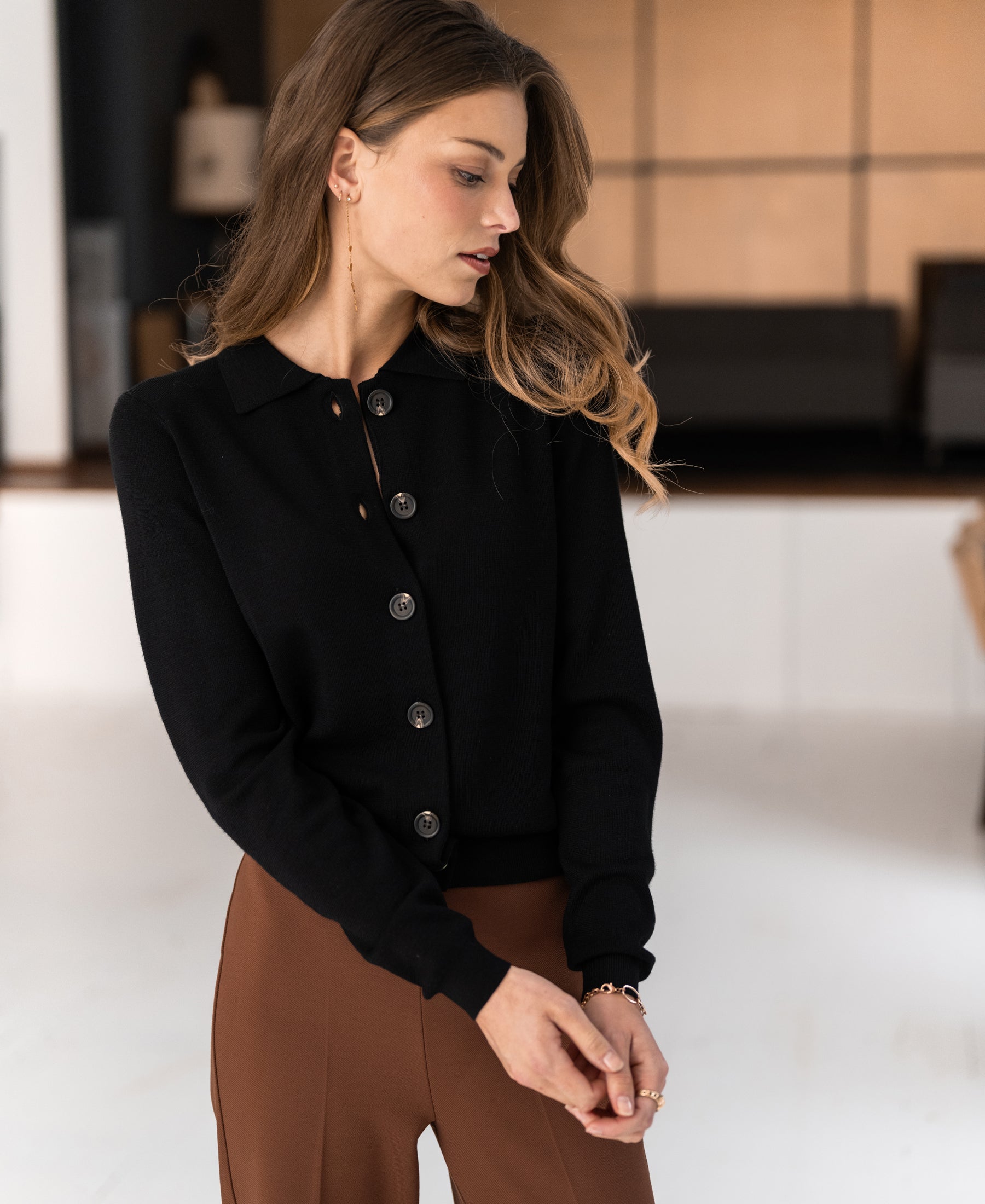 Black Plein Publique Les Vingt polo collar vest, shown indoors.