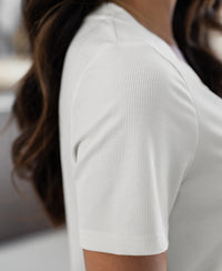 Close-up of the Plein Publique white lyocell T-shirt, showing the shoulder area and texture.
