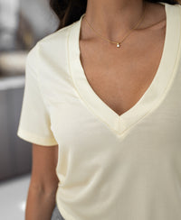 PLEIN PUBLIQUE Lyocell T-shirt in soft yellow, shown from shoulders to waist.