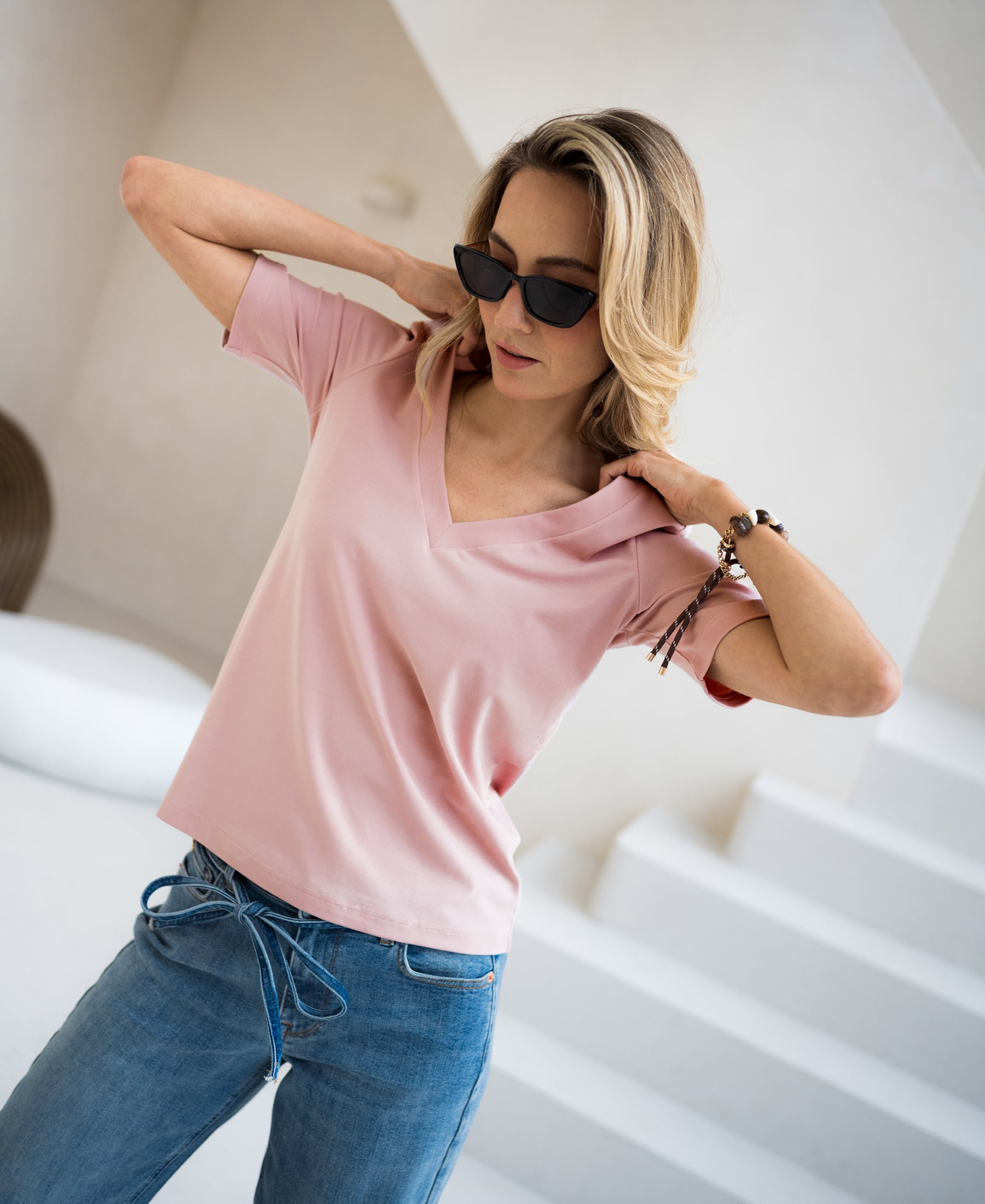 Pink PLEIN PUBLIQUE LA VOIX stretch short sleeve T-shirt, shown indoors by white steps.