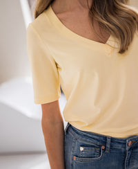 Stretch short-sleeve T-shirt in baby yellow, shown from shoulders to waist.