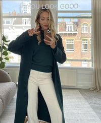 Dark green turtleneck sweater by PLEIN PUBLIQUE shown in mirror view.