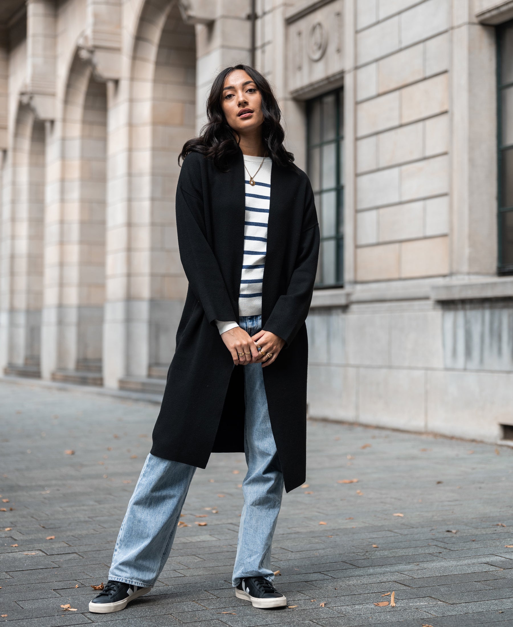 Ivory and denim blue striped Breton sweater by PLEIN PUBLIQUE, style LELISA, shown worn outdoors.