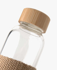 Glass water bottle with bamboo lid by PLEIN PUBLIQUE, sustainable and stylish with jute wrap.
