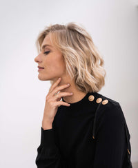 Black and gold merino wool sweater by PLEIN PUBLIQUE, shown on a plain white background.