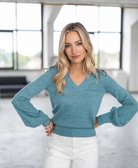 Light blue Merino V-neck sweater LA VICTORIA by PLEIN PUBLIQUE shown from the front.
