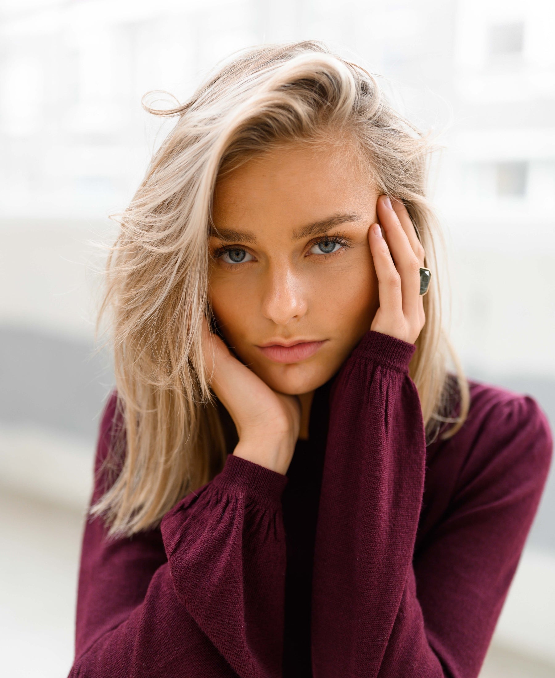 Burgundy LA COEUR sweater by PLEIN PUBLIQUE shown from the front.