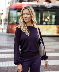 Dark Violet pullover sweater shown worn outdoors.