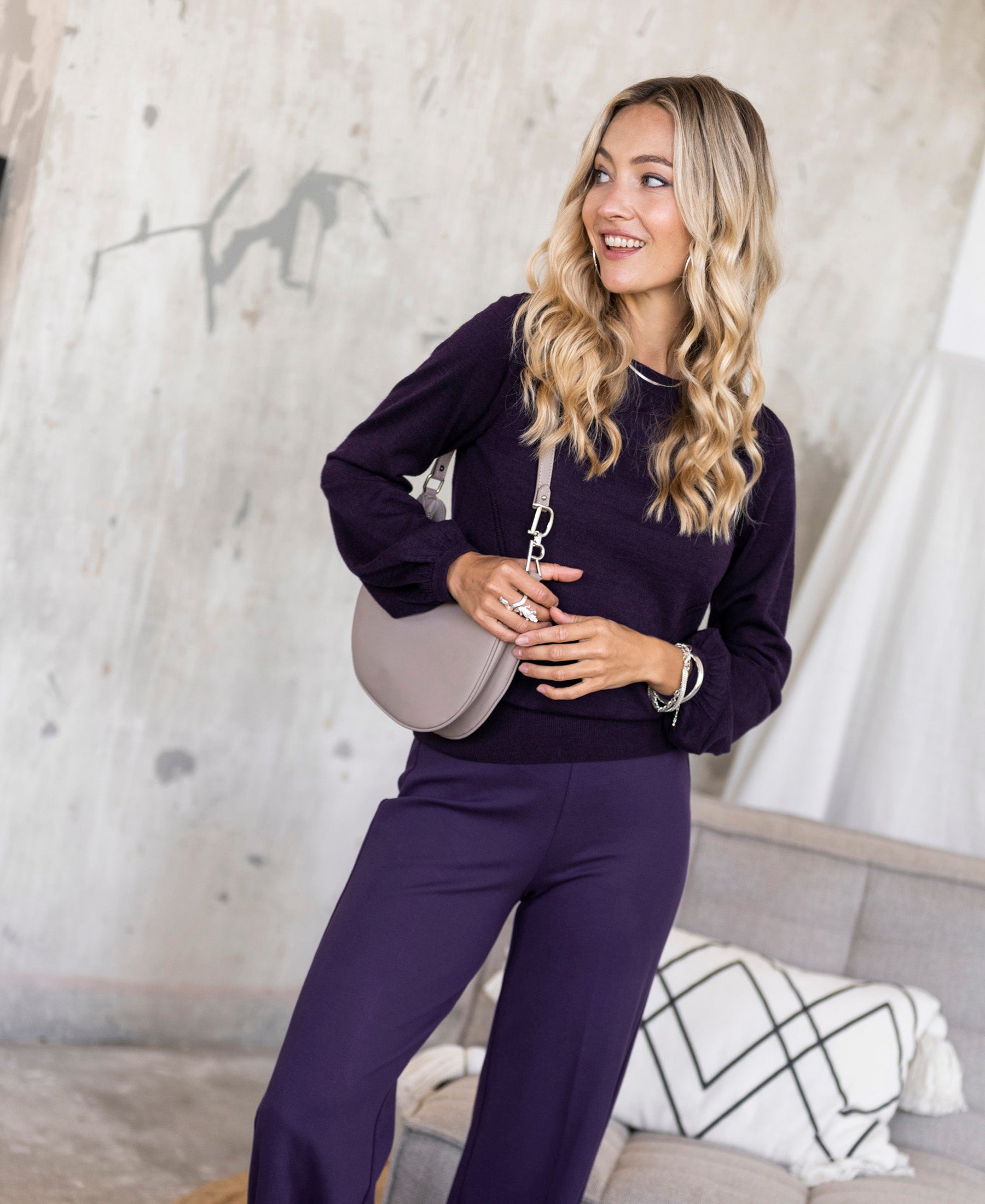 Dark violet LA COEUR sweater by PLEIN PUBLIQUE shown worn by a woman, front view.