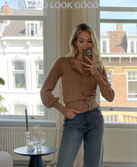 PLEIN PUBLIQUE cardigan LA FRAGANCE in Chai Tea gold, shown in a bright room.