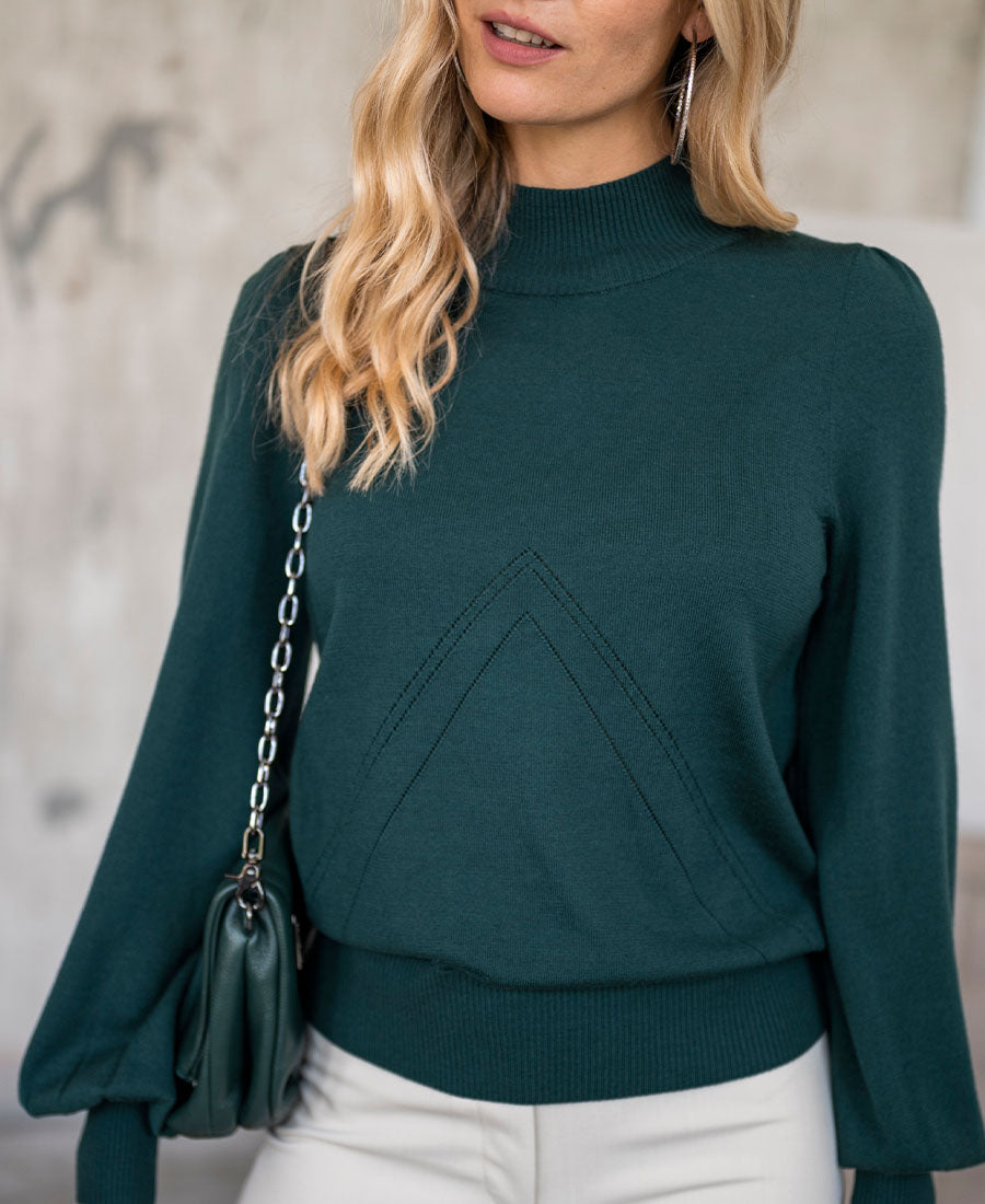 Dark green LES SALLES turtleneck sweater by PLEIN PUBLIQUE against a neutral backdrop.