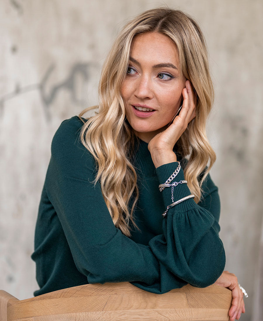 Dark green turtleneck sweater "LES SALLES" by PLEIN PUBLIQUE shown on model.